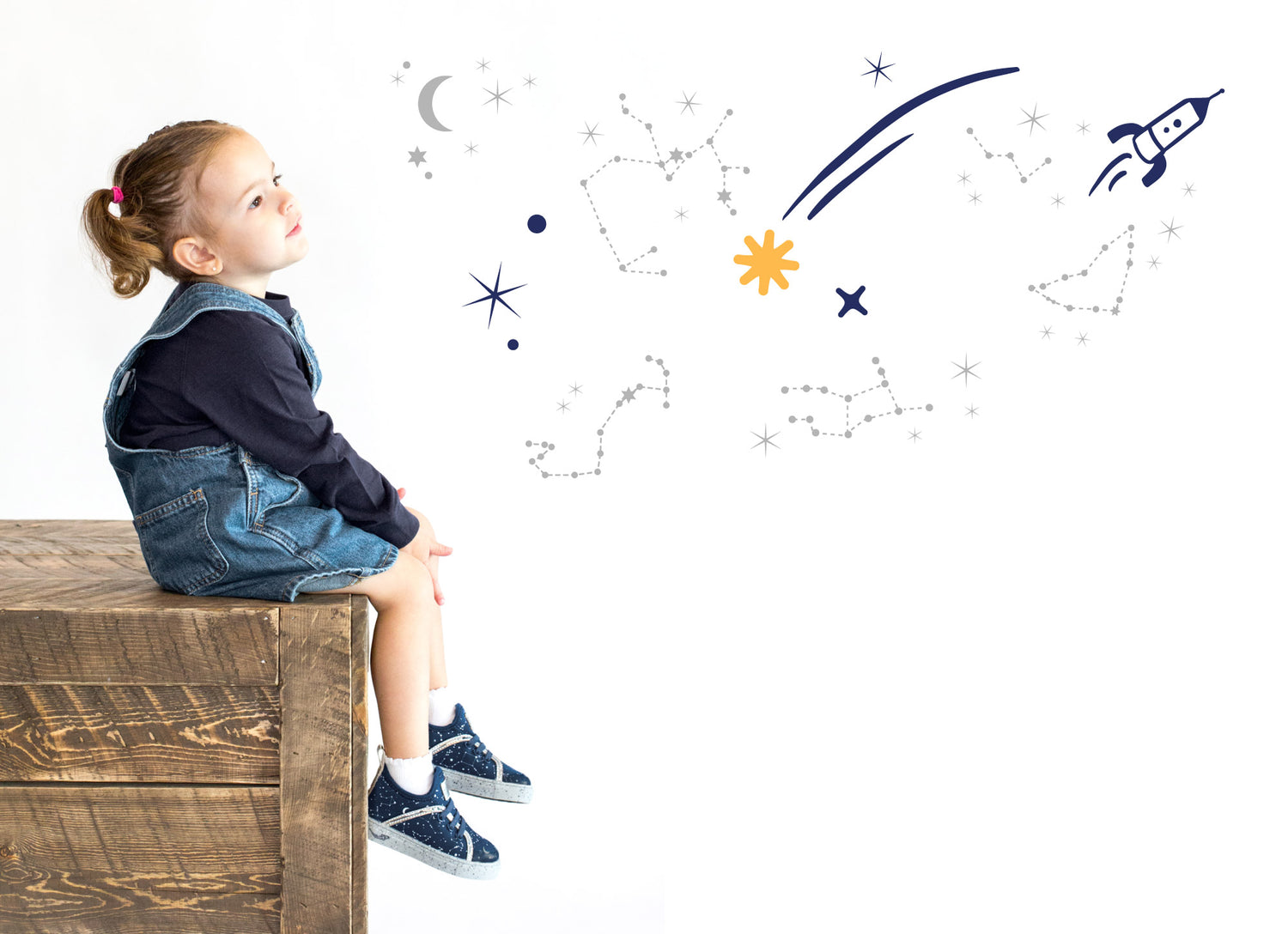 Little Girl wearing Kazoom toddler girl sneakers in blue star pattern